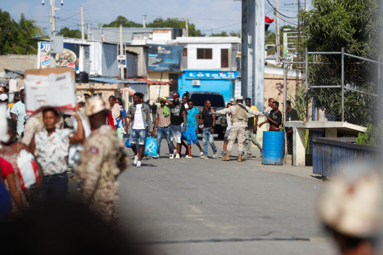 Crowds of people leaving the Dominican Republic ahead of a border closure