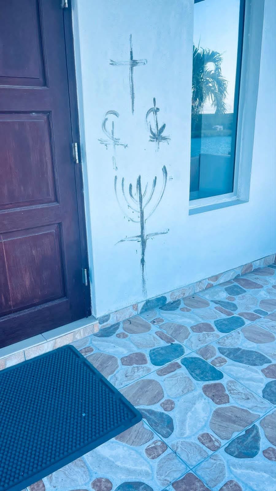 Markings drawn on church walls in downtown Exuma