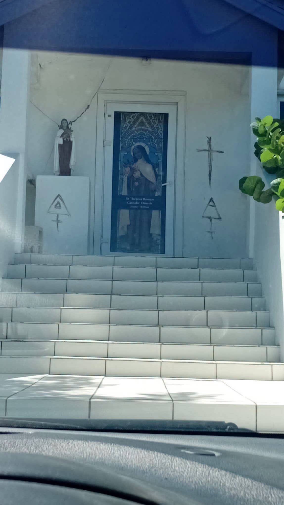 Markings drawn on church walls in downtown Exuma