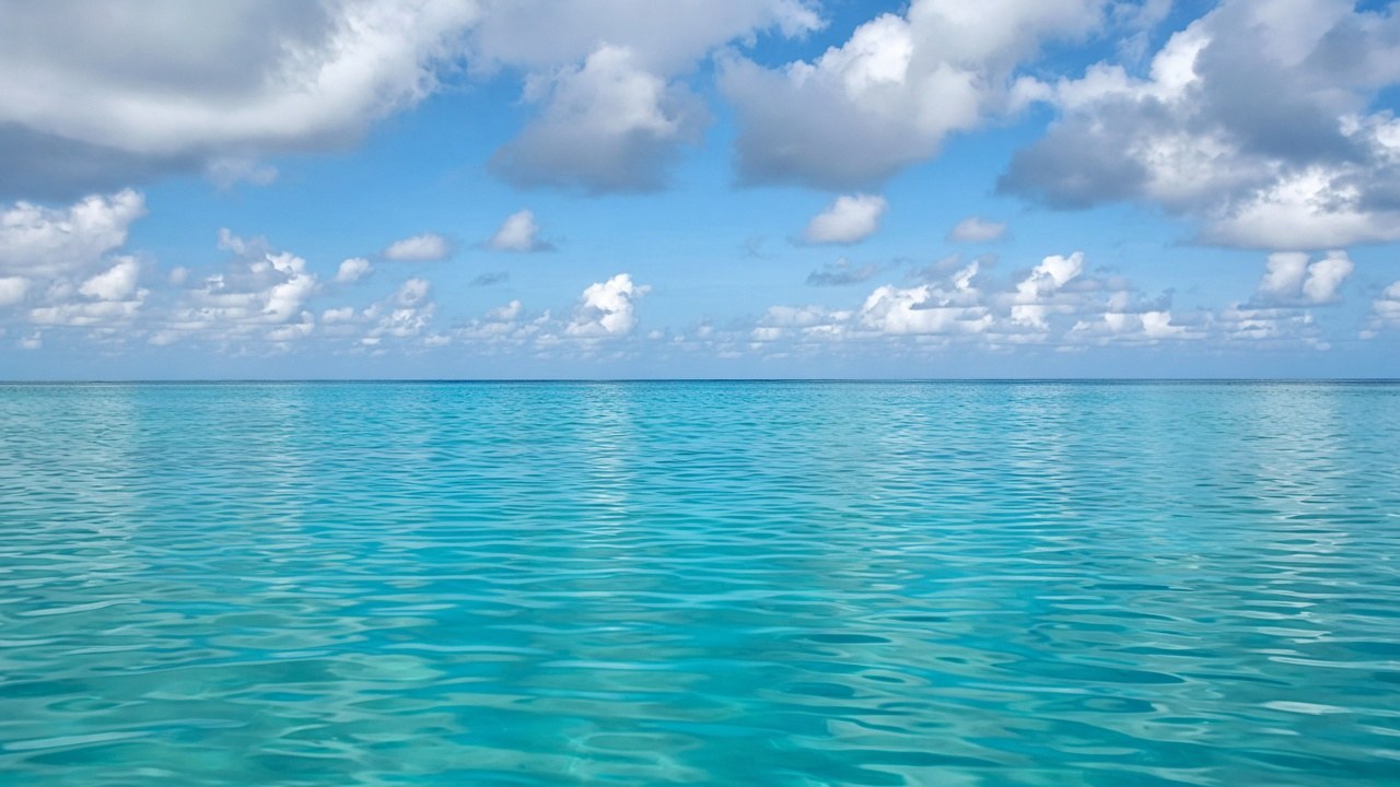 AI-generated illustration of a calm Caribbean sea under a partly cloudy sky