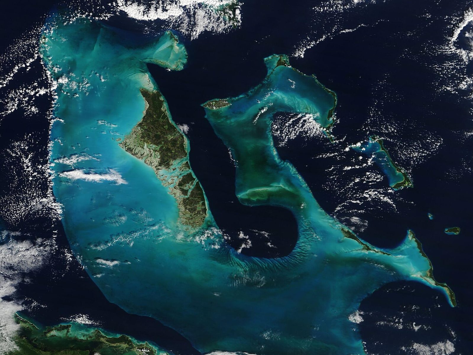 Satellite view of the Bahamas islands and turquoise banks under light cloud
