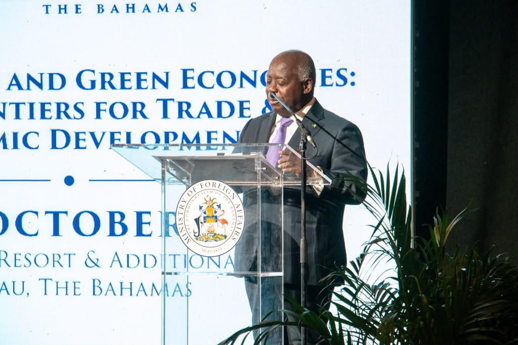 Prime Minister Philip Davis speaking at a podium at the Diplomatic Week 2026 opening