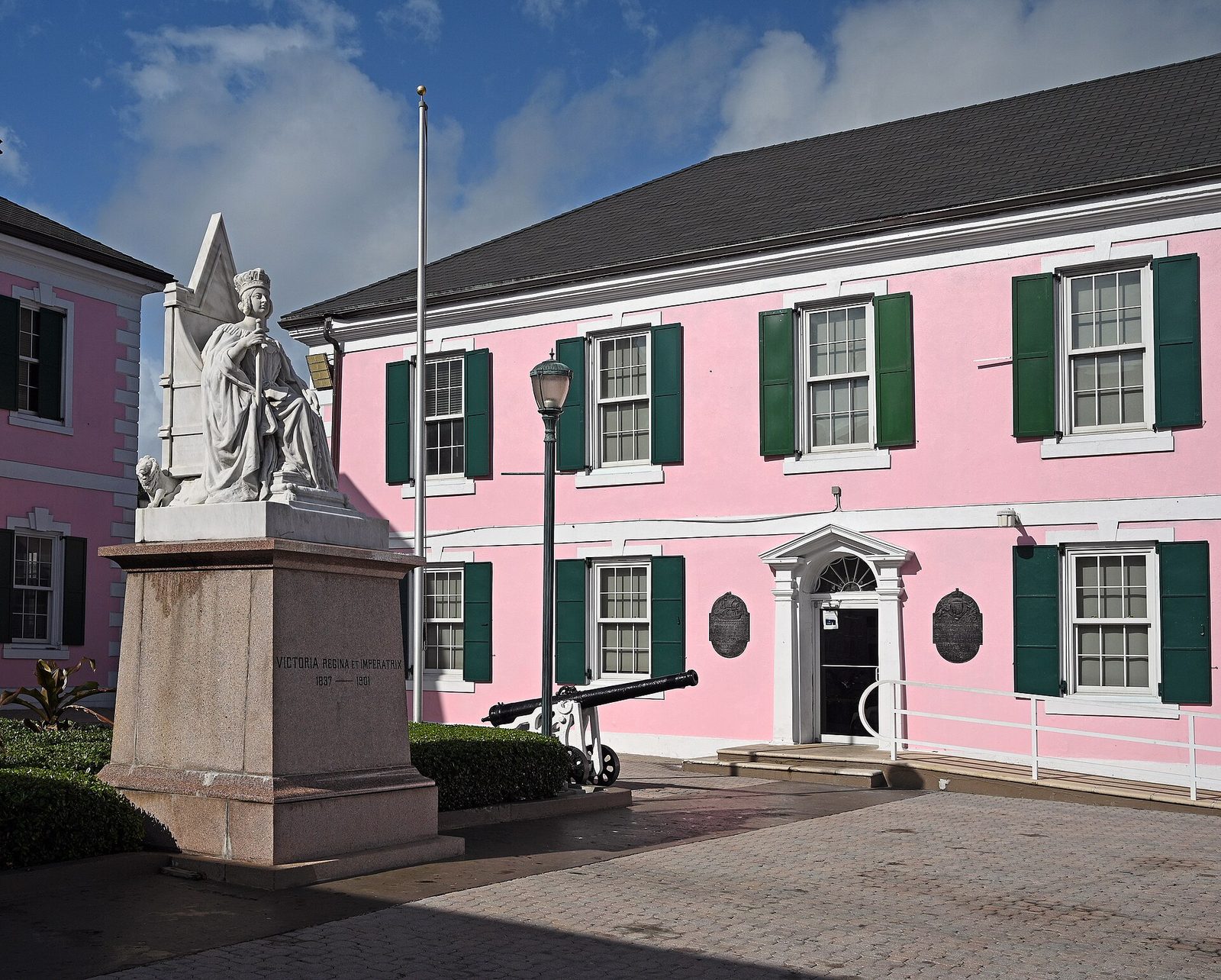 Pink House of Assembly building with the Queen Victoria statue on Parliament Square, Nassau