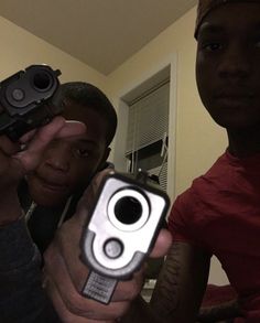 Two male are now in police custody helping the police in their investigation after posting pictures of guns on their Facebook page.