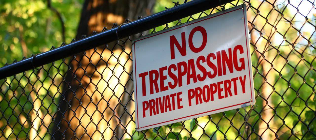 Trespassing laws in election season

Why do politicians knowingly break the trespassing laws of property owners during election season by entering your gated property without conse